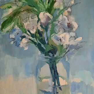 Small bouquet of white bud flowers with green foliage in a jam jar on a soft blue background.