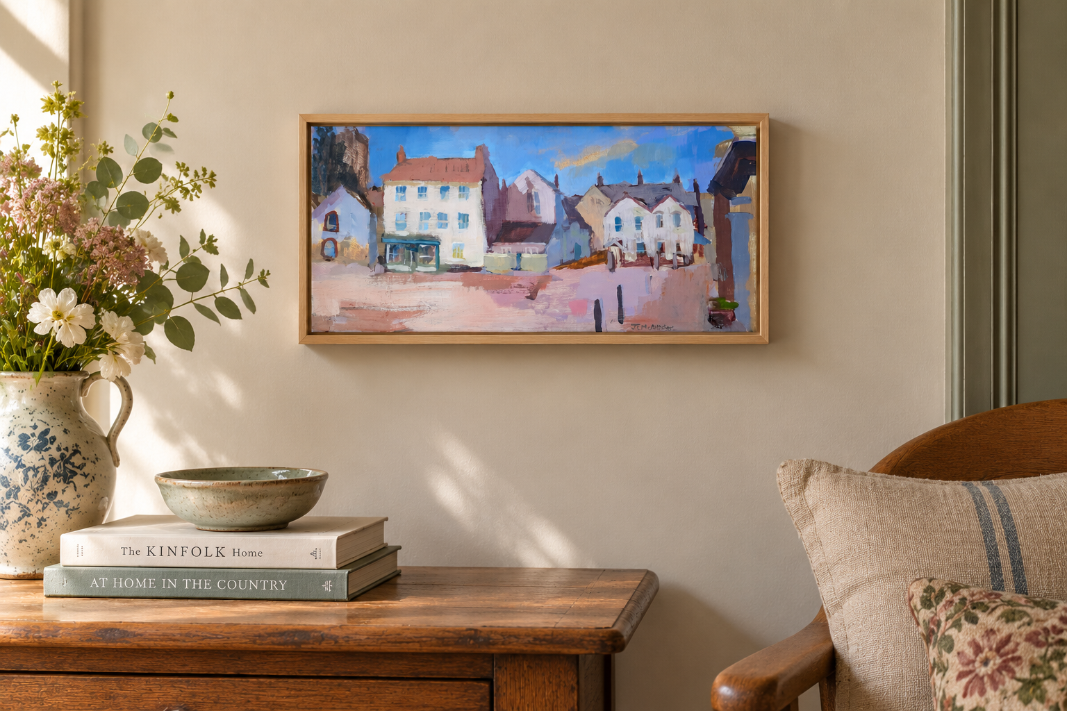Market Square in summer, acrylic painting, displayed on wall of cottage in a natural wood float frame